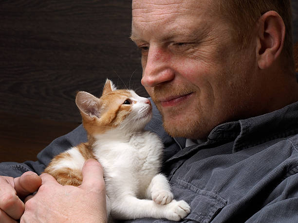 istock Portrait of a man with a kitten 512341046