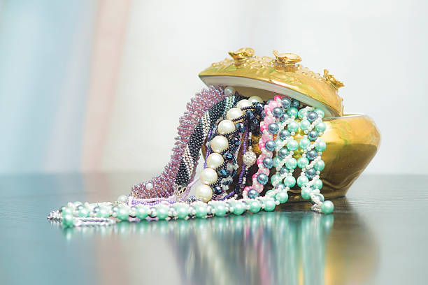 istock Bunch of beaded jewelry in a vase 512341908