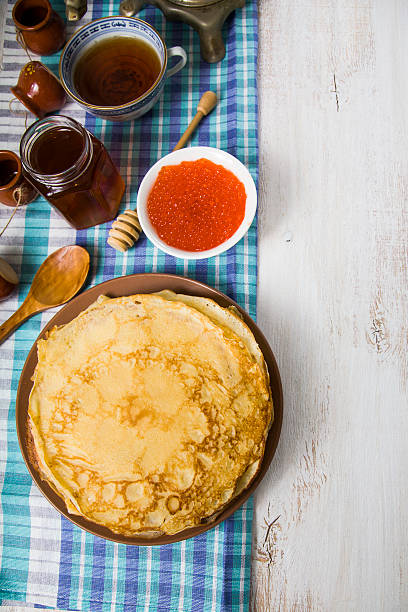 istock Pancakes with red caviar on a table 512342560
