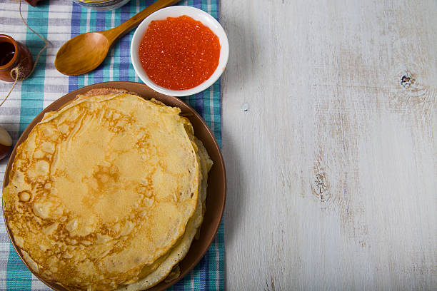 istock Pancakes with caviar on the table 512342858