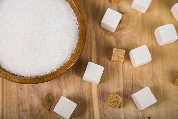 istock Sugar in a wooden bowl 512343472