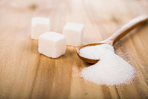 istock Sugar in a wooden spoon 512343538