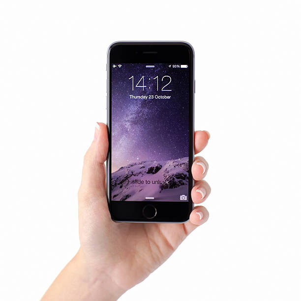 Alushta, Russia - October 23, 2014: Woman hand holding iPhone 6 Space Gray with unlock on the screen. iPhone 6 was created and developed by the Apple inc.