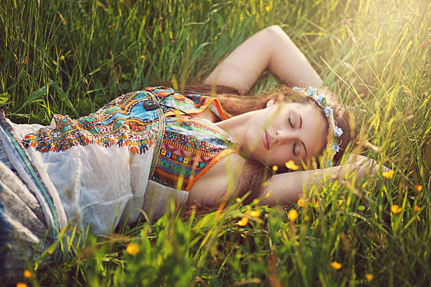 Young female lying on grass in a park