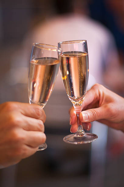 istock Celebration: cheering with a glass of champagne 512348470