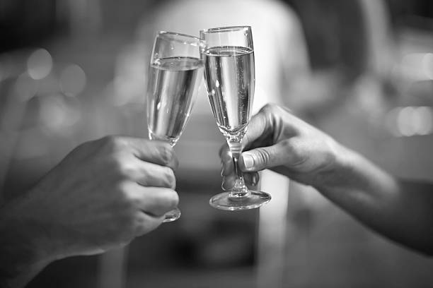istock Celebration: cheering with a glass of champagne 512348508