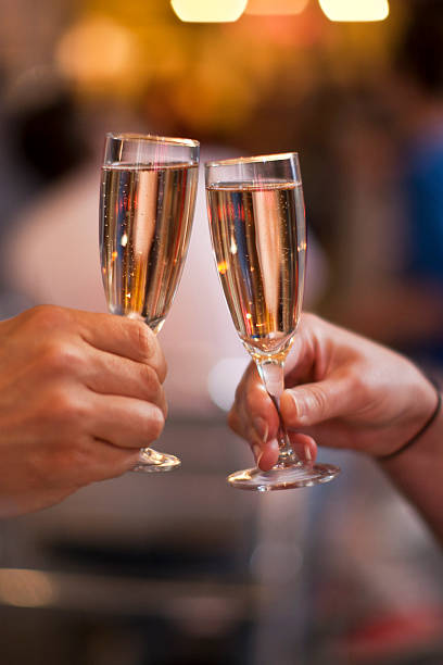 istock Celebration: cheering with a glass of champagne 512348530