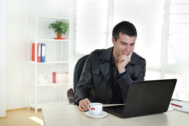 istock Man working on laptop in the office 512350050