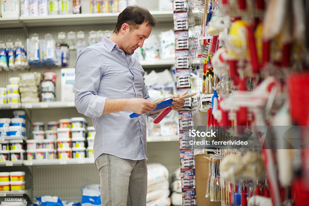 Man in a hardware store Man in a hardware storeMan in a hardware store Hardware Store Stock Photo