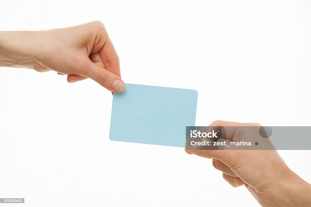 Two hands pull in different directions a blue paper card Two hands pull in different directions a blue paper card, white background Greeting Card Stock Photo