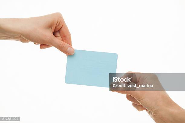 Two Hands Pull In Different Directions A Blue Paper Card Stock Photo - Download Image Now