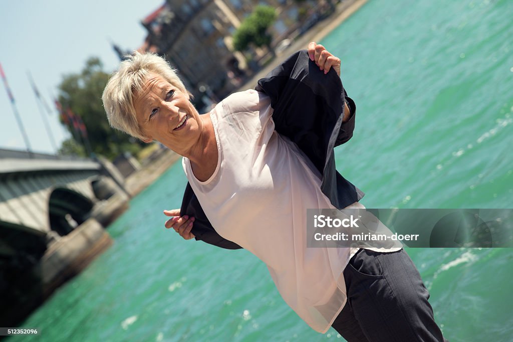 Business woman making a break on the Water Business woman making a break on the Water, concept: relaxing and lifestyle 50-59 Years Stock Photo