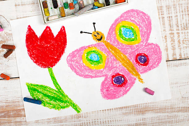 istock colorful drawing: happy butterfly and beautiful tulip 512356374