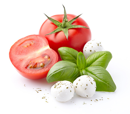 Mozzarella, tomatoes, basil spice on a whitу background