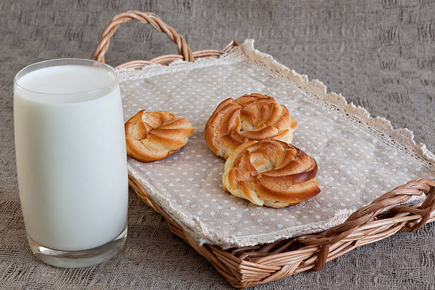istock Milk and donuts on rustic wooden background 512357754