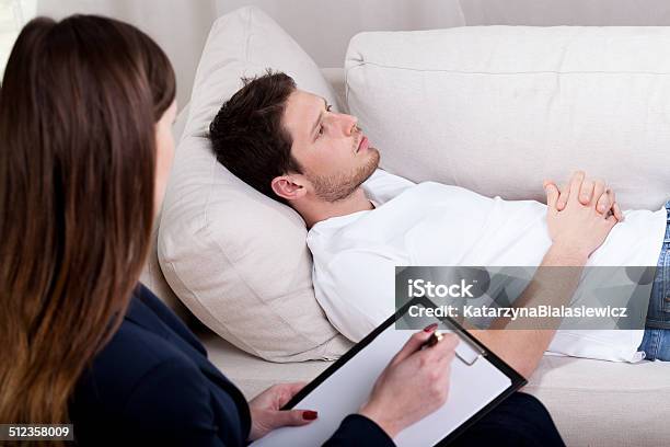 Therapist Working With Patient On Hypnosis Stock Photo - Download Image Now - Adult, Alternative Therapy, Assistance