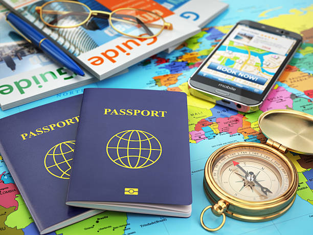istock Travel guide concept. Passport, compass, guidebooks, mobile 512358082