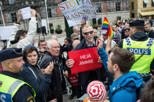 Malmö, Sweden - September 13, 2014: Different political supporters clashing at a square meeting in Malmö, two days before the elections