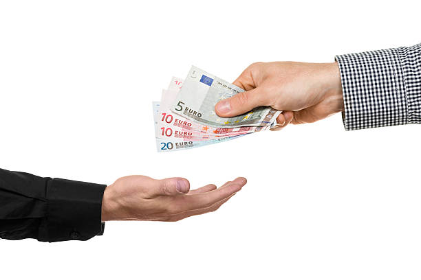 istock Man hands over euro banknotes to another man 512359815