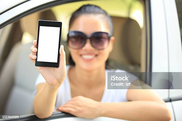 Happy Woman Driver Hold Blank Smart Phone Stock Photo - Download Image Now - Adult, Adults Only, Asian and Indian Ethnicities