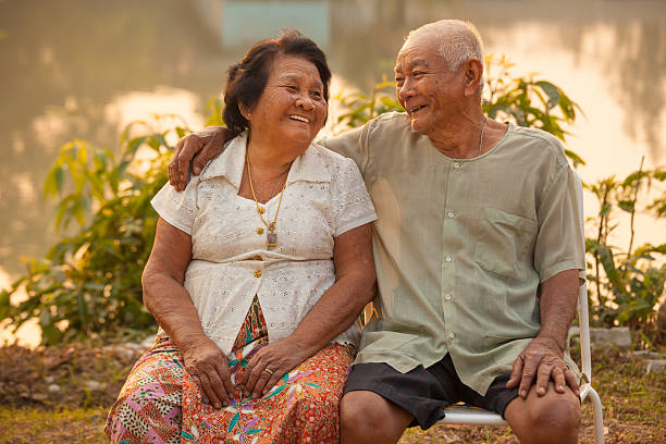 istock Happy Senior couple sitting outdoors 512360165