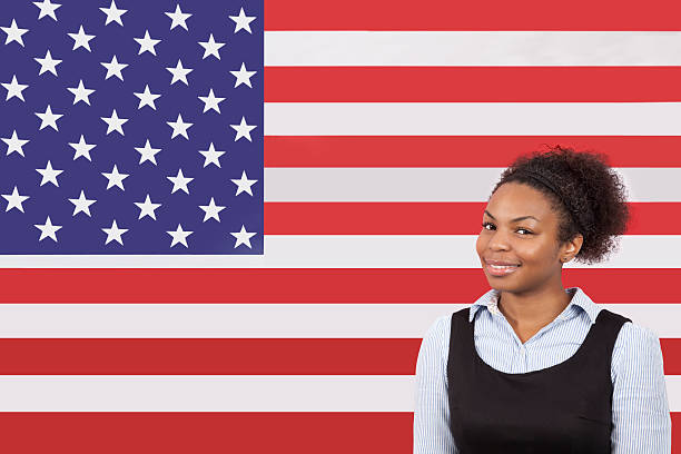 istock Business person in front of flag 512360567