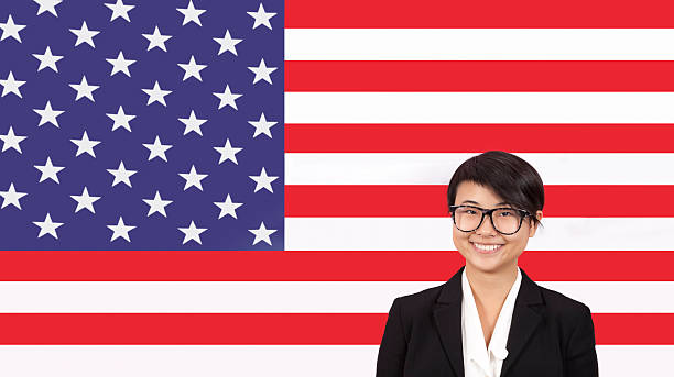istock Business person in front of flag 512360571