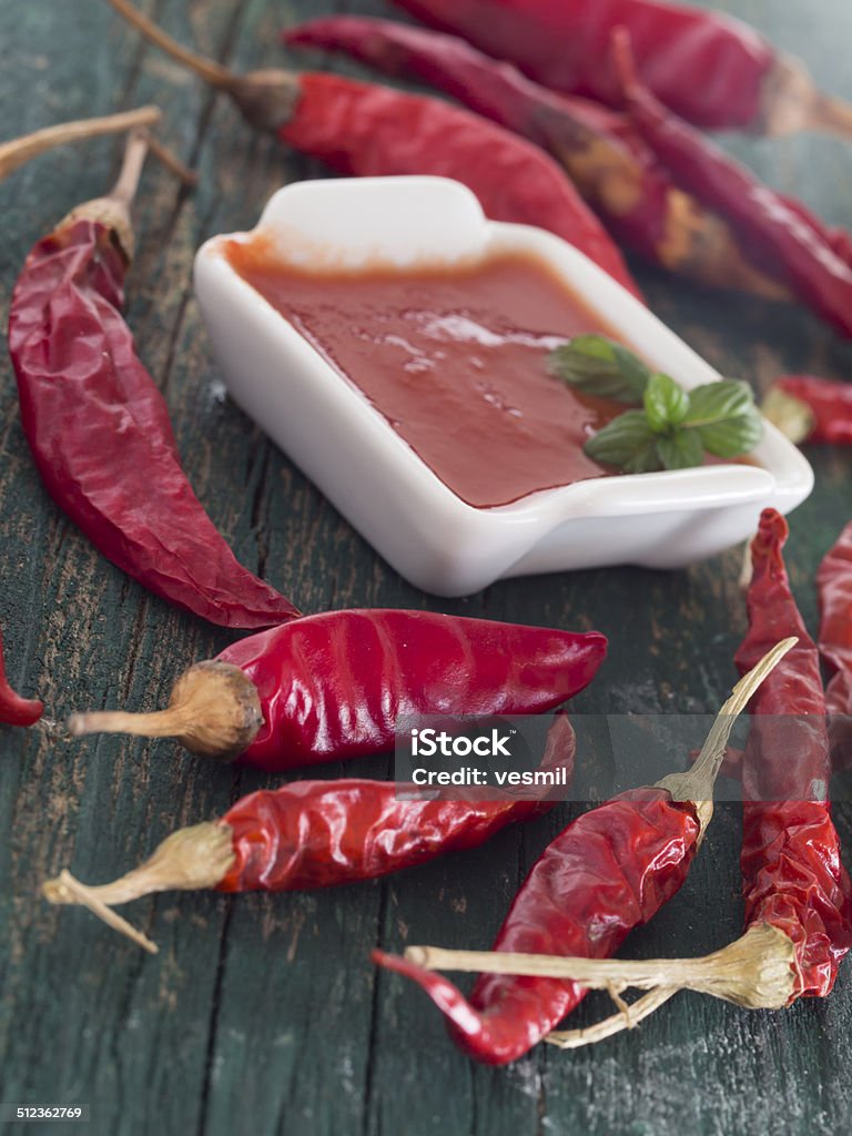 red hot chili peppers with souce Heat - Temperature Stock Photo