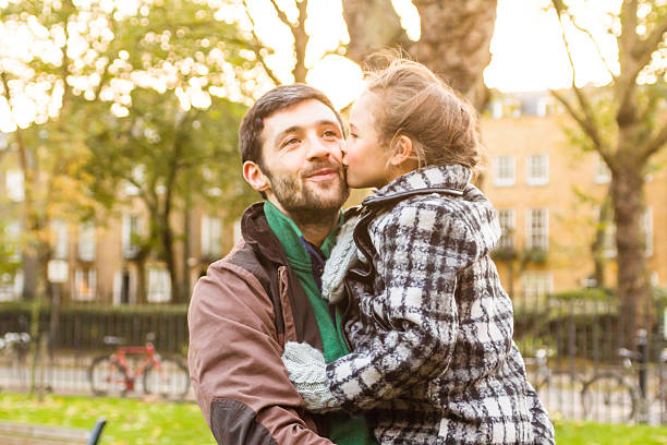 istock Daughter kisses her father on a cheek 512364133