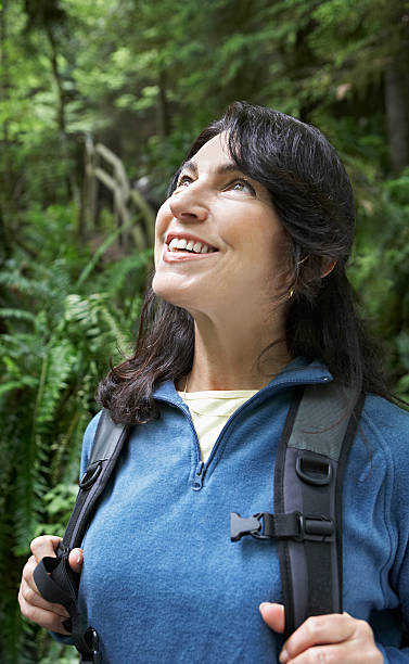 istock Smiling Middle Aged Woman In Forest 512385213