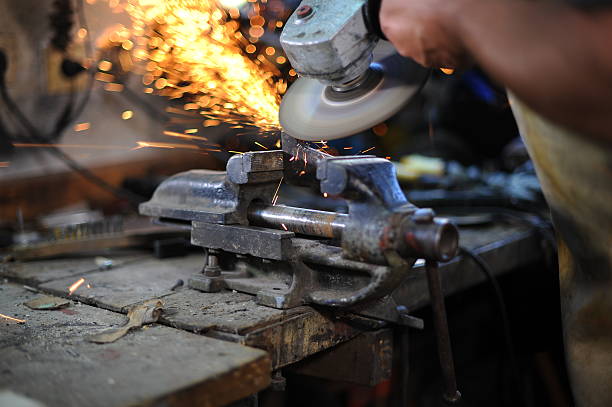 istock removing metal with grind and sparks 512385769