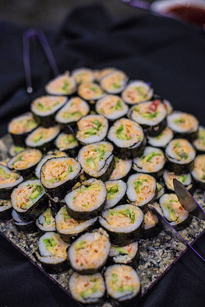 istock Gourmet spicy tuna sushi rolls on granite display 512386151