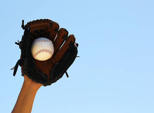 istock Hand of Baseball Player with Glove and Ball 512387005