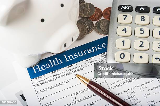 Health Insurance Form With Piggy Bank Stock Photo - Download Image Now - Accidents and Disasters, Bringing Home The Bacon, Business
