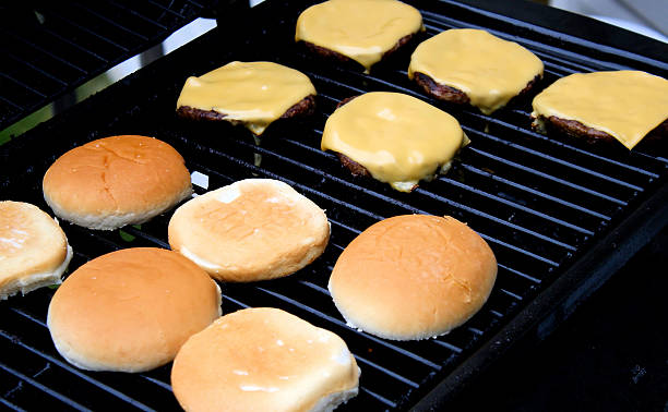 istock Cheeseburgers Cooking On The Grill 512388423