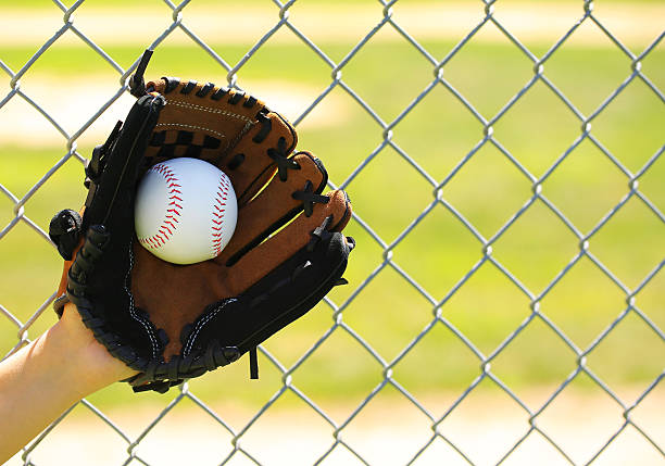 istock Hand of Baseball Player with Glove and Ball 512388433