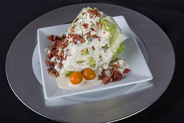istock Gourmet iceberg lettuce wedge with bacon, blue cheese dressing tomato 512389429