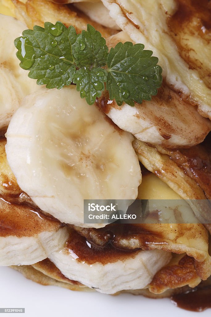 pancakes with banana, mint and chocolate pancakes with banana, mint and chocolate closeup vertical. macro Banana Stock Photo