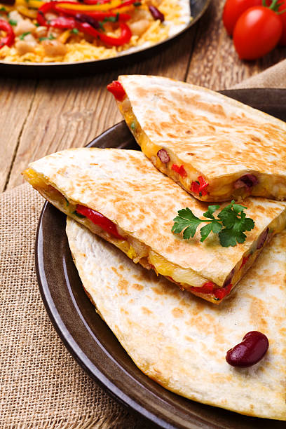 istock Quesadilla with chicken, served with guacamole or salsa sauce. 512396696