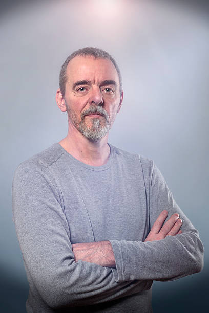 istock Portrait of a smiling man with crossed arms 512398564