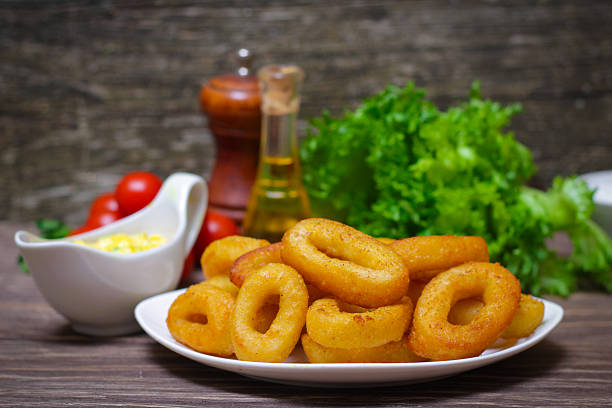 istock deep fried calamari with sauce and salad 512399136