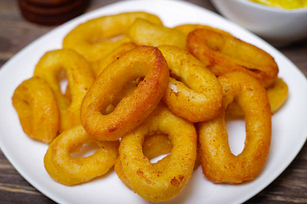 istock deep fried calamari with sauce and salad 512399190