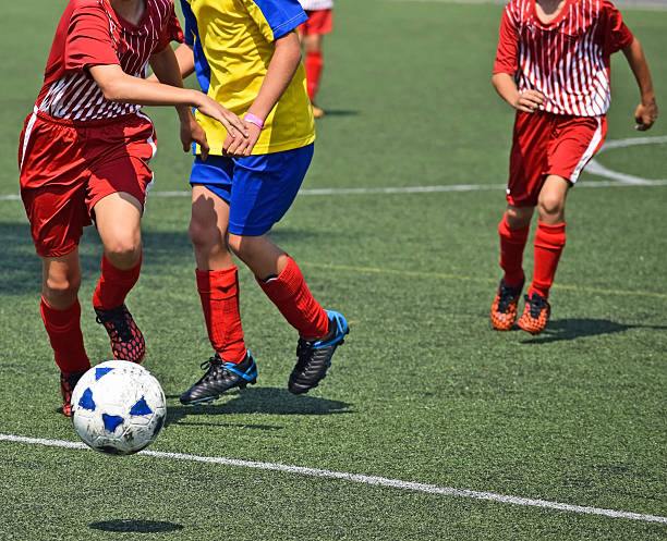 istock Children are playing soccer 512400328