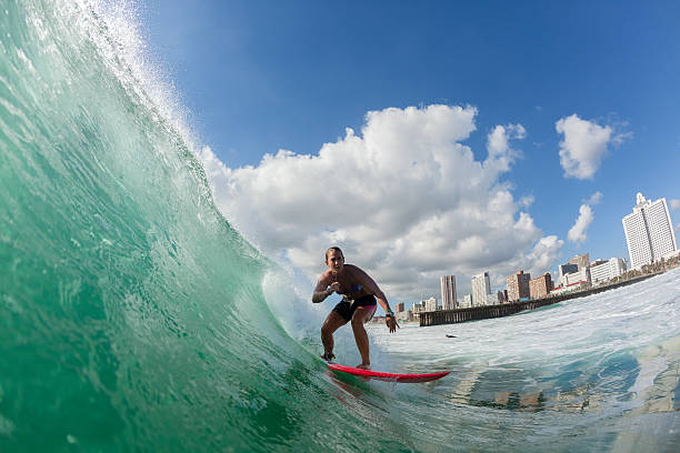 Durban , South-Africa  - February 10, 2016: Surfing girl summer ocean wave closeup water action