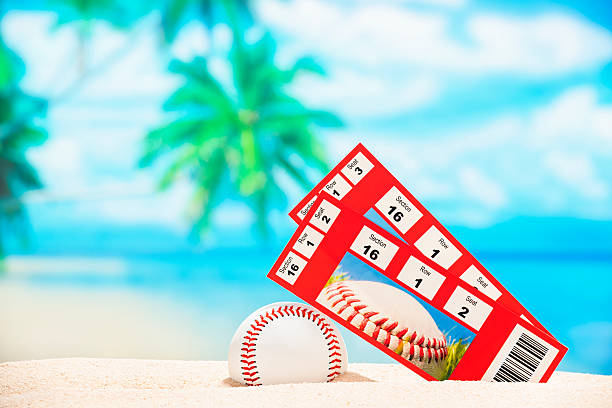 istock Two baseball tickets stubs on the beach for Spring Training 512407378