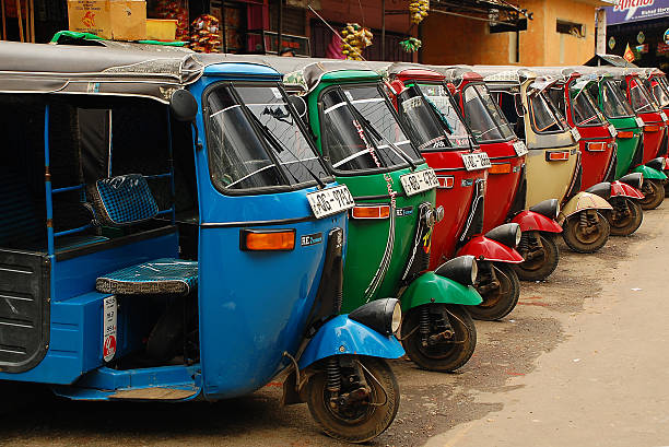 Three-wheelers Colombo, Sri Lanka - December 5, 2008:Three-weelers at the tuk-tuk stand in the capital of the country taxi sri lanka stock pictures, royalty-free photos & images