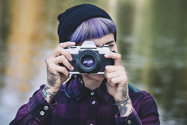 istock Girl taking a photo with a film camera 512408574