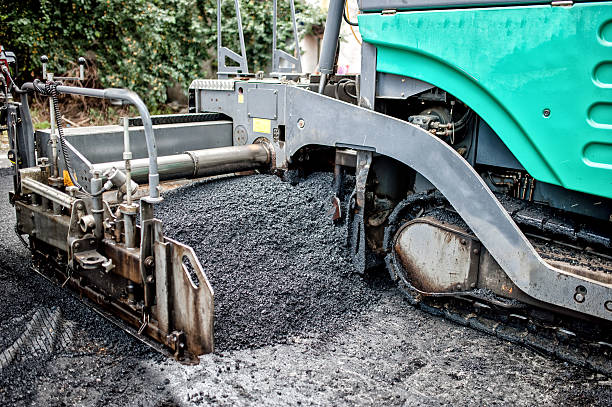 istock detail of asphalt paver machine during road construction 512415925