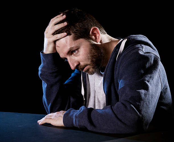istock desperate man suffering emotional pain, grief and deep depression 512416421