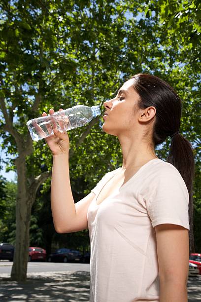 istock woman profile drinking water 512416829